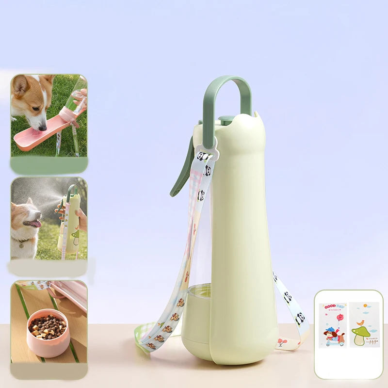 Green portable dog water bottle with carry loop and strap, shown with a food bowl for walks
